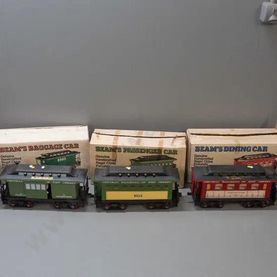 5-piece Jim Beam railway decanter set: Locomotive and 4 cars with New Jersey Central Railroad markings, all sealed with