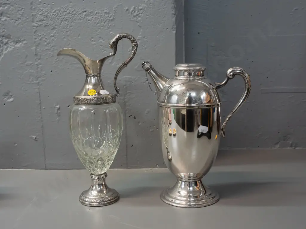 Italian glass and silver plated claret jug H-310 and a plated hot water jug with stoppered spout. Claret jug missing Image 1++