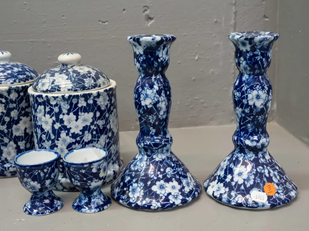 7 pieces of Chinese blue & white AOF prunus / calico style porcelain - 3 lidded canisters, 2 egg cups, pair of candle- Image 1++