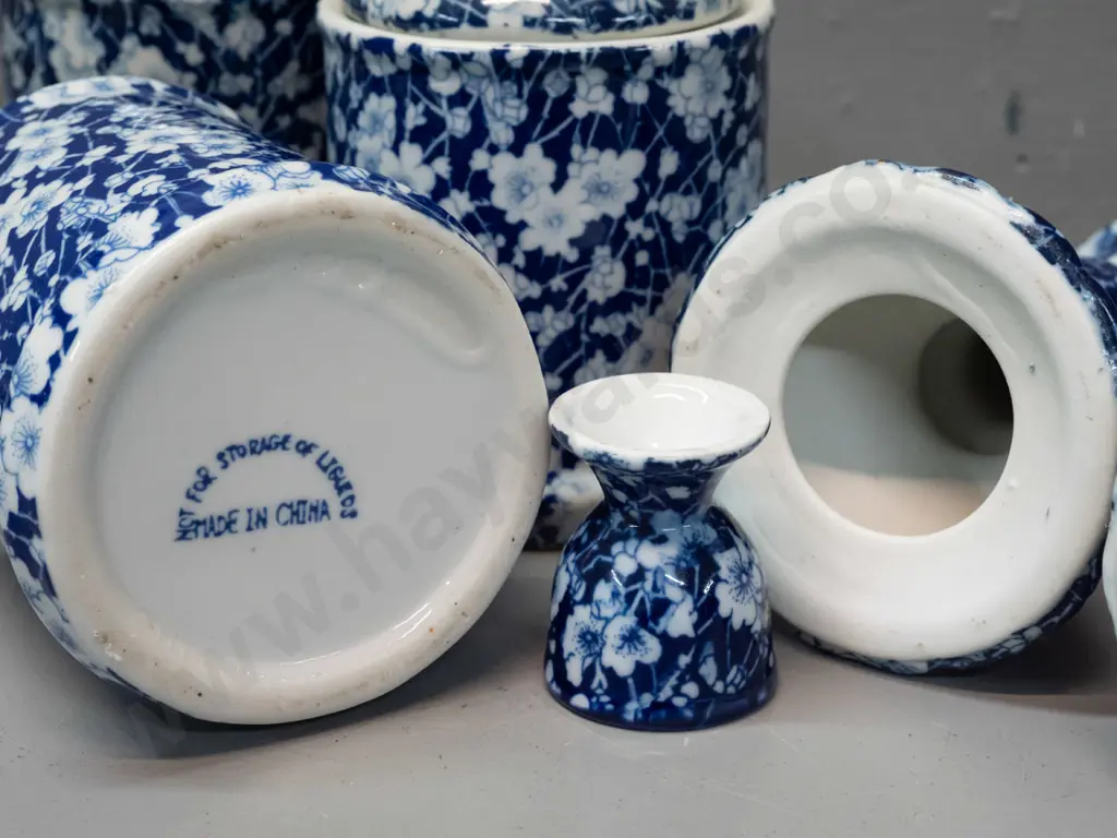 7 pieces of Chinese blue & white AOF prunus / calico style porcelain - 3 lidded canisters, 2 egg cups, pair of candle- Image 1++