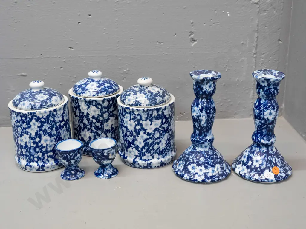 7 pieces of Chinese blue & white AOF prunus / calico style porcelain - 3 lidded canisters, 2 egg cups, pair of candle- Image 1++
