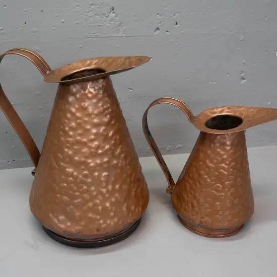 2 vintage beaten copper jugs with scroll-end handles, no maker's mark, some discolouration inside, larger is H-335 L-300