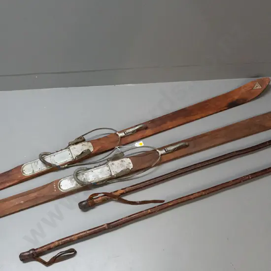 pair of vintage alpine skis, timber w/ metal edging & SkiRite Toronto/Willi Walch Austria bindings. Decal reads