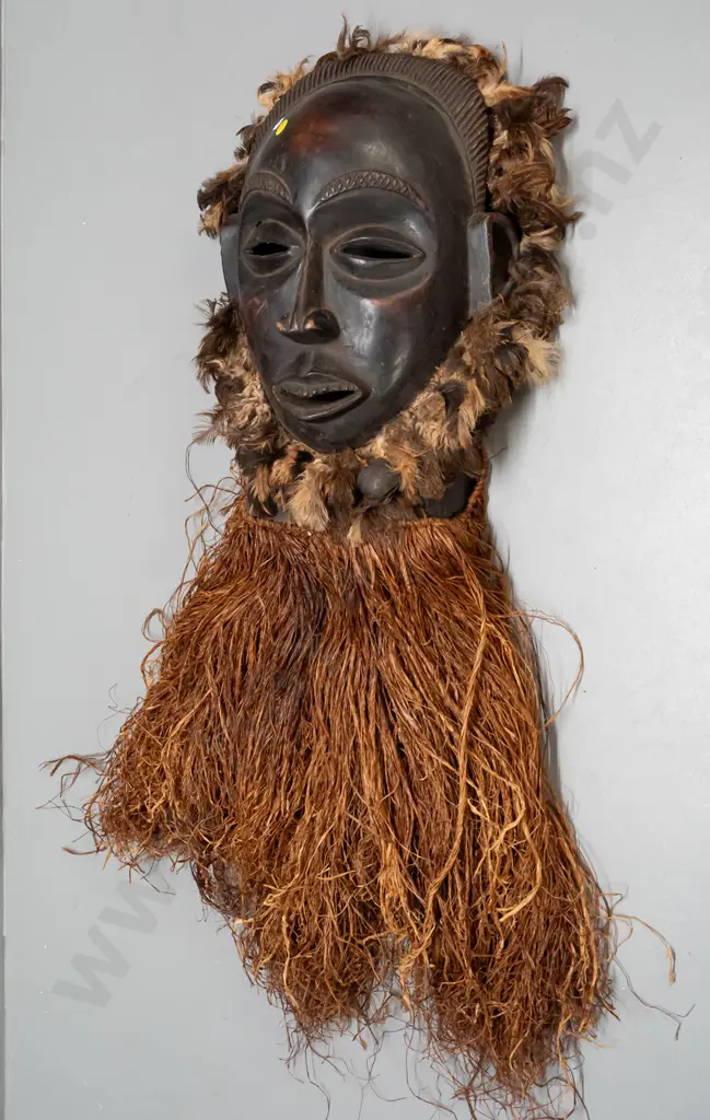 African carved wood mask with fibre and feather decoration & metal bell. Chokwe, Democratic Republic of Congo H-820 Image 1++