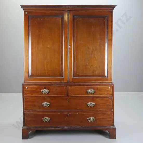 late Georgian mahogany linen press with 2 panelled doors, 3 sliding shelves, 4oak-lined drawers, on bracket feet, box-