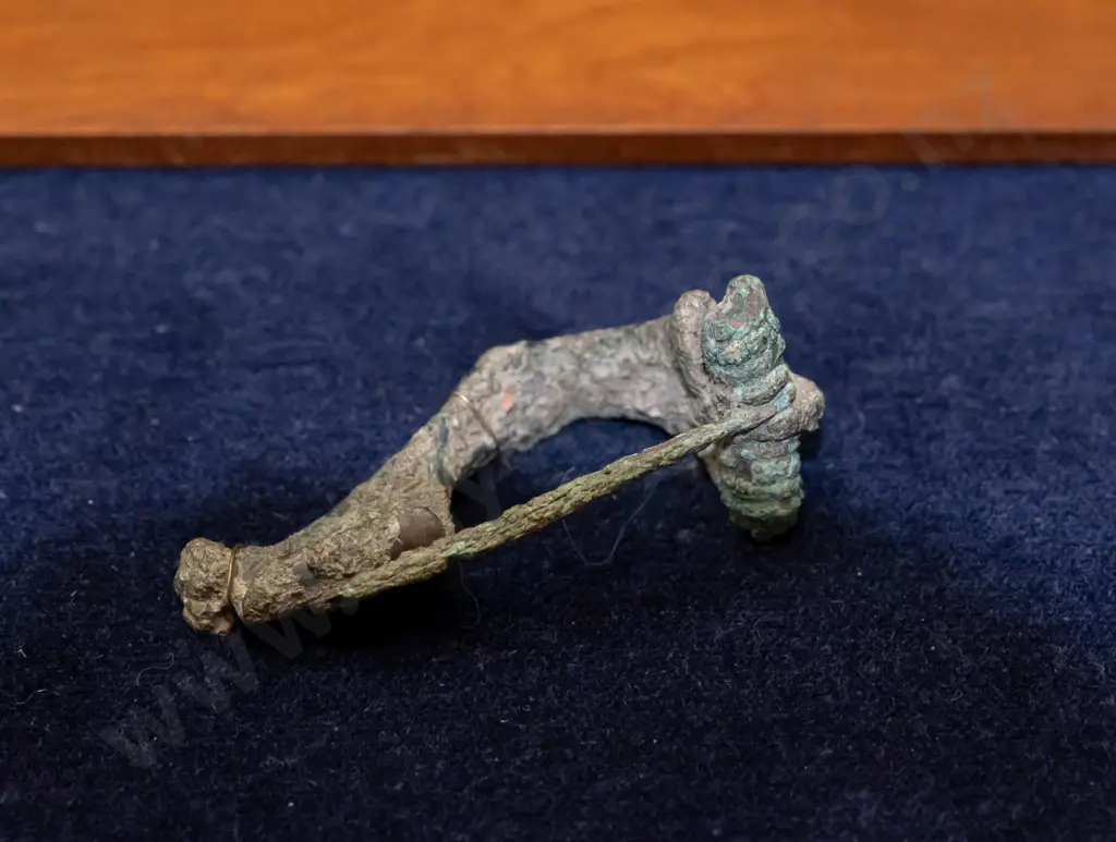 ancient Roman fibula mounted to fabric backed picture frame - has corrosion - frame H-145 W-290 Image 1++