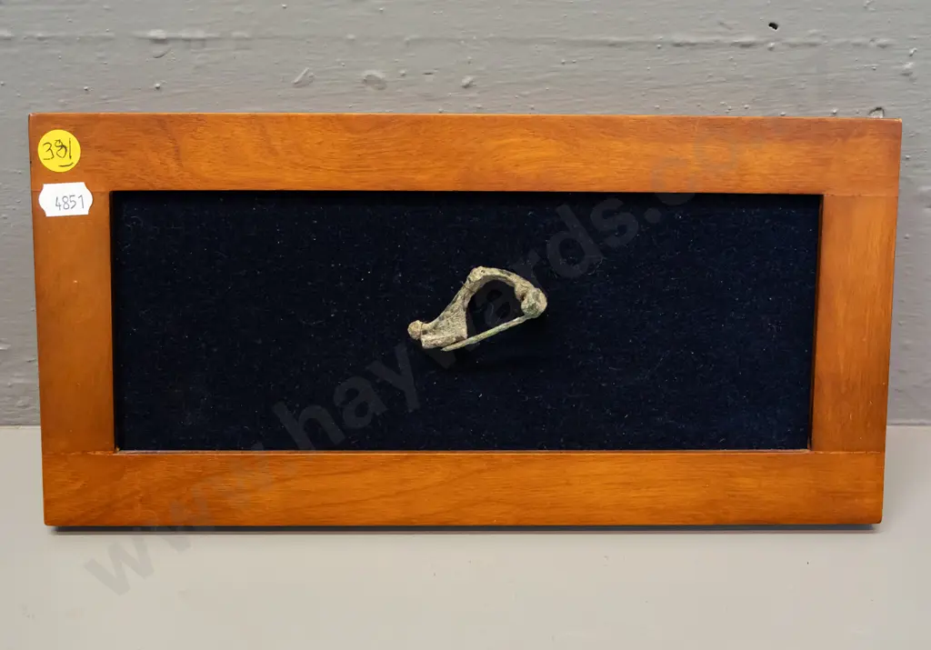 ancient Roman fibula mounted to fabric backed picture frame - has corrosion - frame H-145 W-290 Image 1++