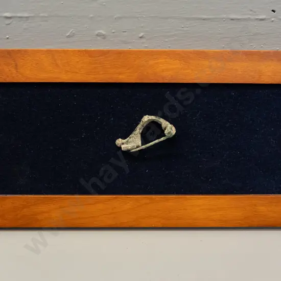 ancient Roman fibula mounted to fabric backed picture frame - has corrosion - frame H-145 W-290