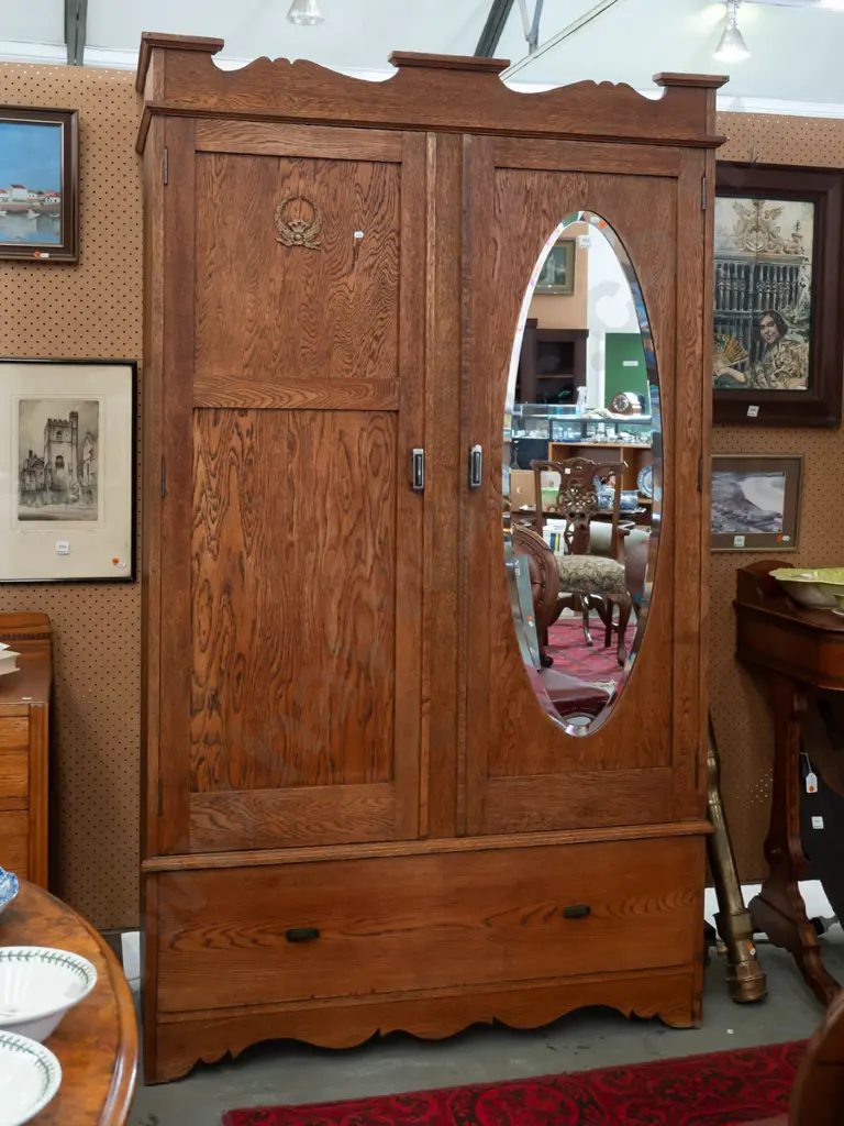 art deco oak double-door wardrobe, one panelled door & one with bevelled edge oval mirror, boot drawer. Locks removed Image 1++
