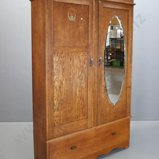 art deco oak double-door wardrobe, one panelled door & one with bevelled edge oval mirror, boot drawer. Locks removed