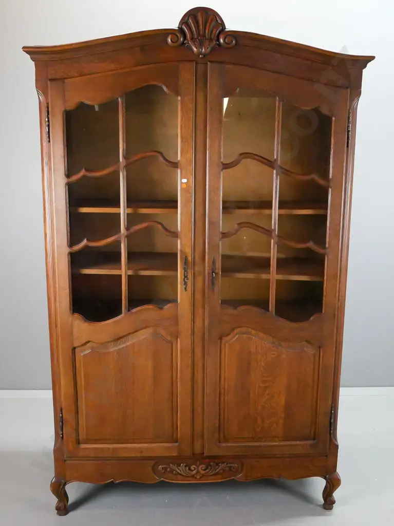 French oak 2-door cupboard with 2 astragal glazed doors, shaped door panels, and short cab legs, carved decoration and Image 1++