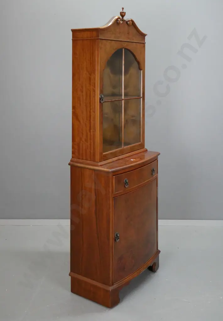 reproduction Victorian style walnut display cabinet with cupboard in base, swan neck pediment and arched glazed door, Image 1++