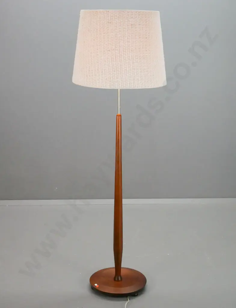 retro teak standard lamp with brass finish stem and loose weave fabric over plastic shade. Some scratching to base Image 1++