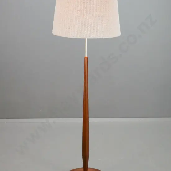 retro teak standard lamp with brass finish stem and loose weave fabric over plastic shade. Some scratching to base