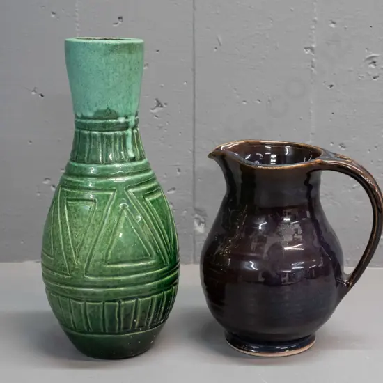 2 pieces of New Zealand studio pottery - green glazed geometric pattern vase - unknown mark (JF or JK?) with some glaze