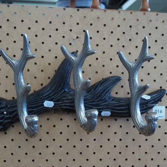 cast metal antler themed coat hooks