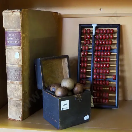 vintage leather bound book, abacus, wooden petanque style game