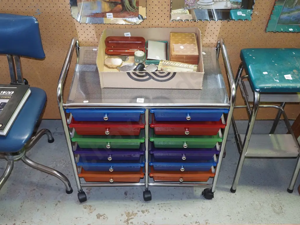 multi coloured plastic organiser trays in metal frame on casters Image 1++