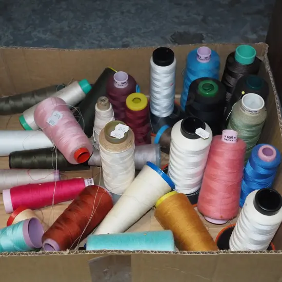 box of spools of sewing thread