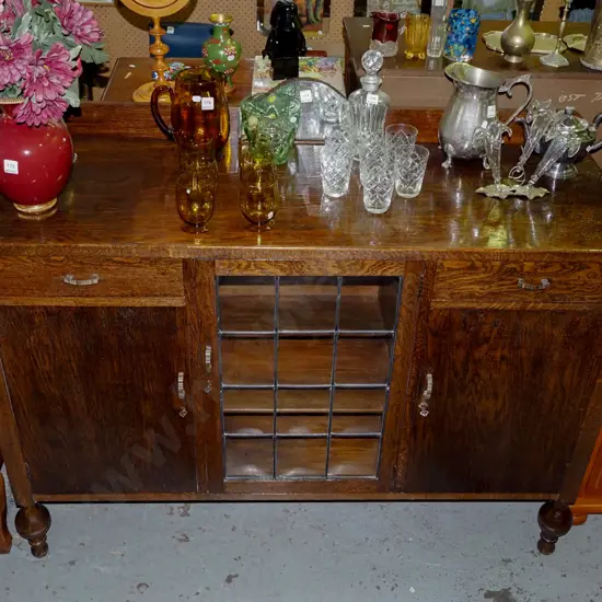 oak deco sideboard with 2 doors, 2 drawers, 1 convex 12 pane leadlight door