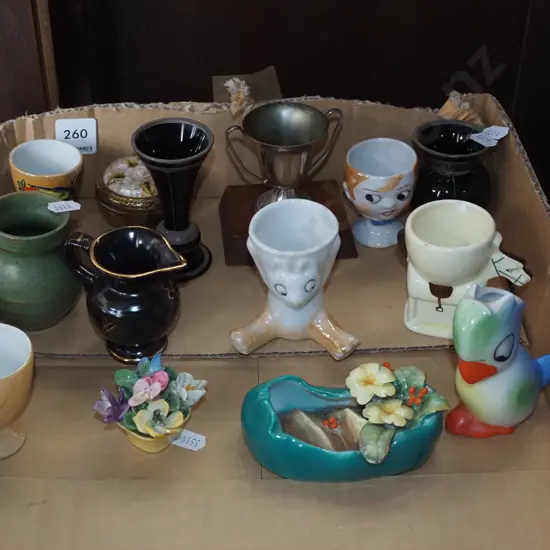 box; egg cups, small trophies, floral spray etc