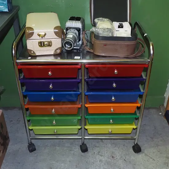 multi coloured plastic organiser trays in metal frame on casters