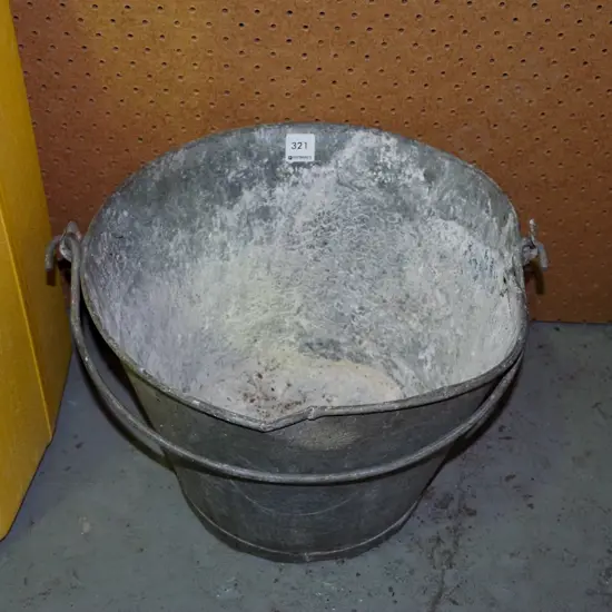 beaten galvanised bucket