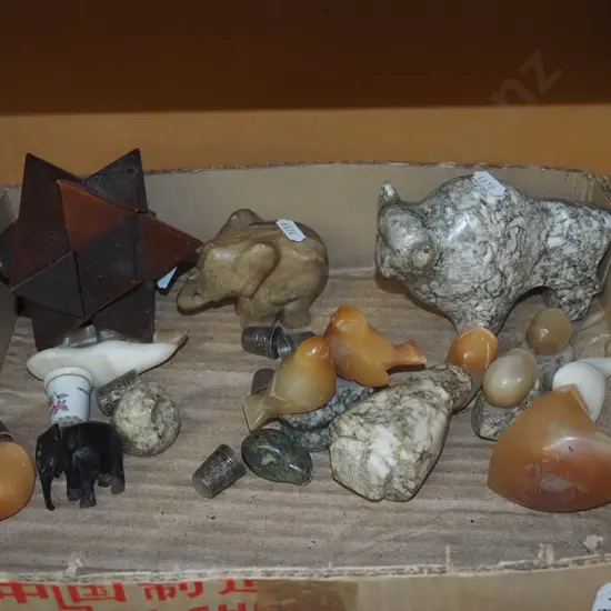 box; wooden puzzle, carved stone animal figurines, various thimbles