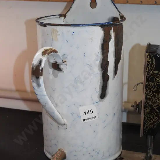 rusty enamel wall mounted measuring jug