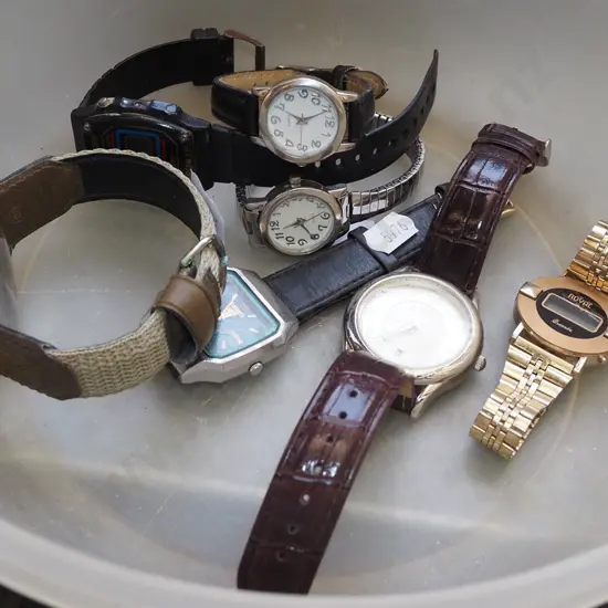 plastic bowl of wristwatches
