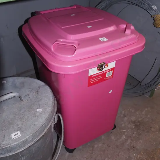 pink plastic 60L wheelie bin