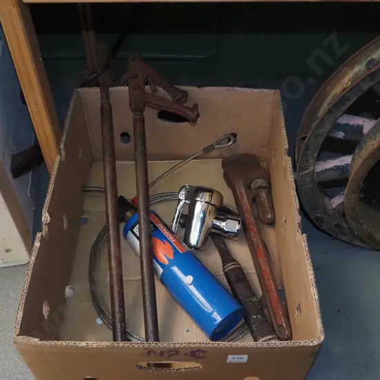 box; plumbers stilsons, hammer, wire strainer