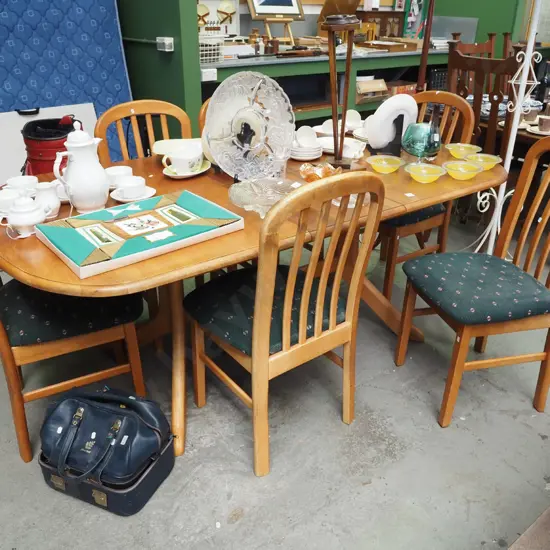 solid rimu extending dining table with 6 upholstered chairs  - fading to table, chairs needa  clean