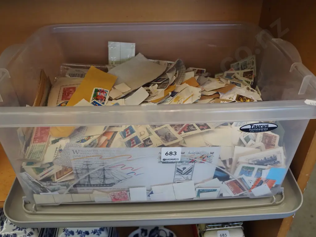 plastic tub of stamps Image 1++