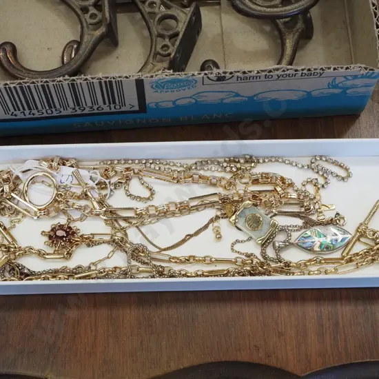 box of costume necklaces