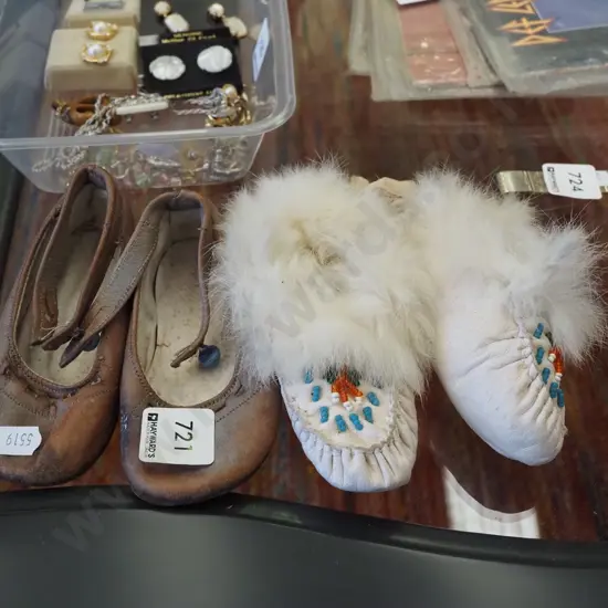 pair of child's shoes and moccasins