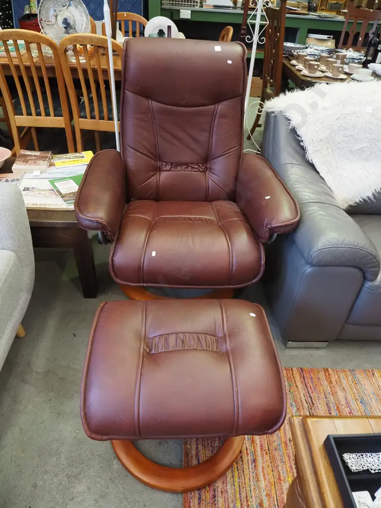 dark red leather reclining swivel armchair with footstool - some marks and scratches on foot Image 1++