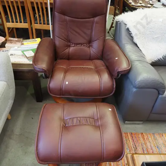 dark red leather reclining swivel armchair with footstool - some marks and scratches on foot