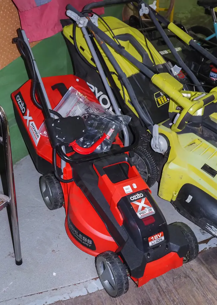 Ozito battery powered lawn mower with accessories and charger Image 1++
