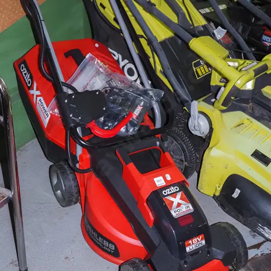 Ozito battery powered lawn mower with accessories and charger