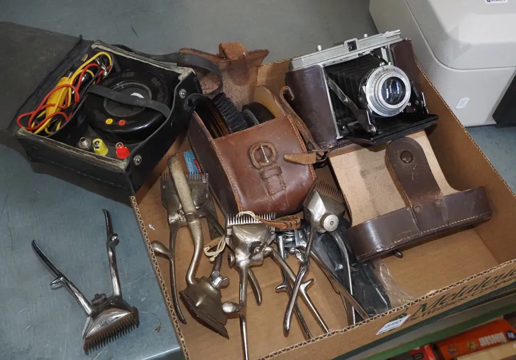 box; hand held clippers, clothes brushes, vintage leather cased camera, voltmeter Image 1++