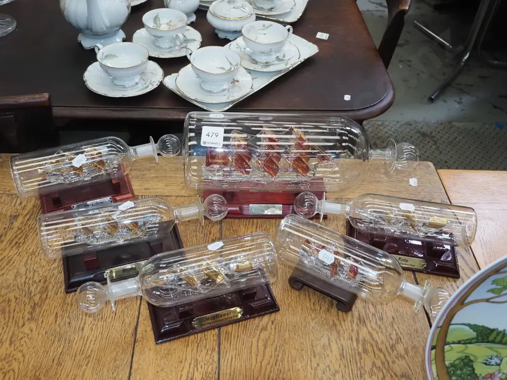 5x glass ships in bottles on stands L310 Image 1++
