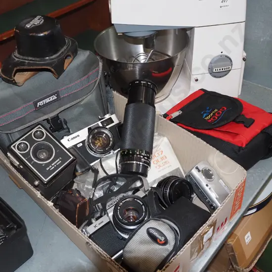 box of film,cameras, bags and accessories and a Sony digital camera