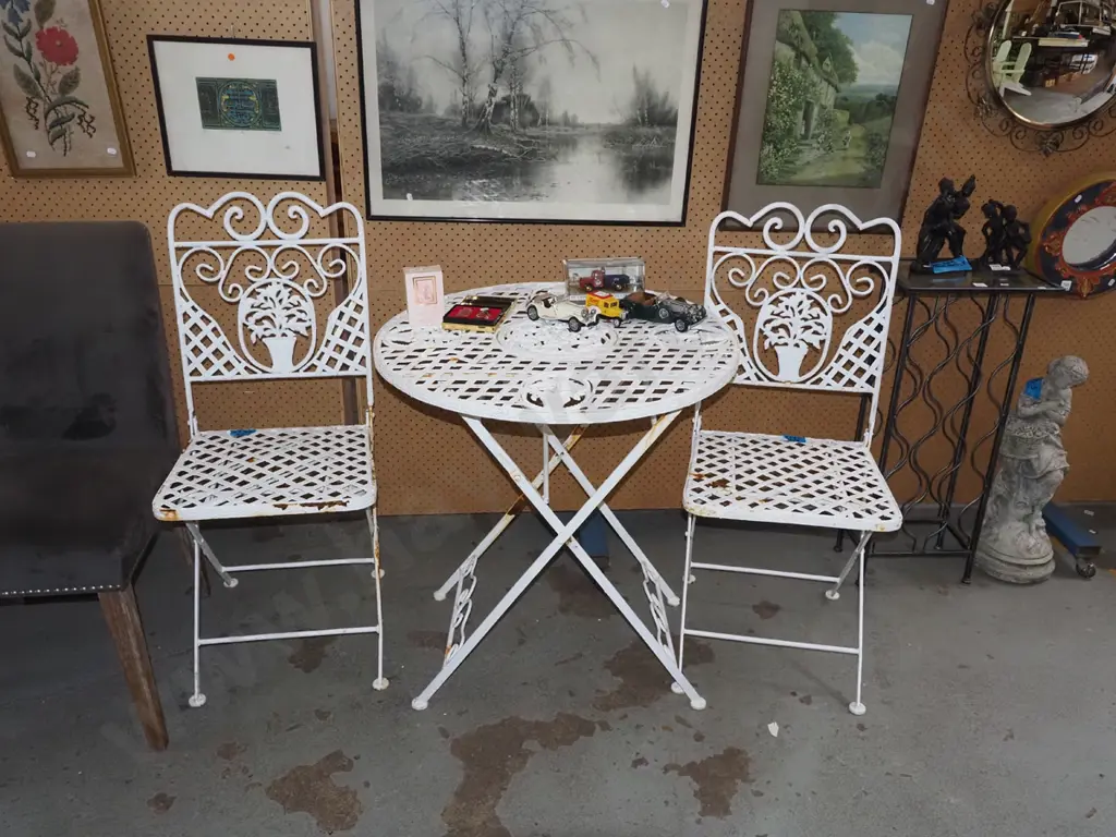 metal foldaway patio table with 2 chairs - rust to chairs Image 1++