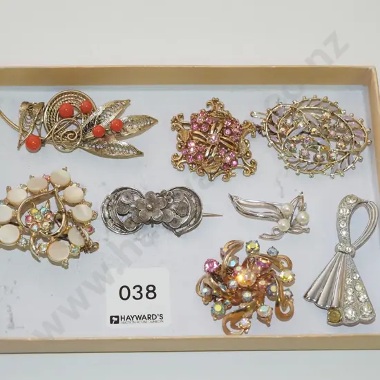 tray of brooches