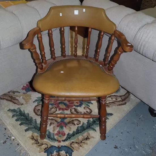 solid wood spindle backed vinyl armchair