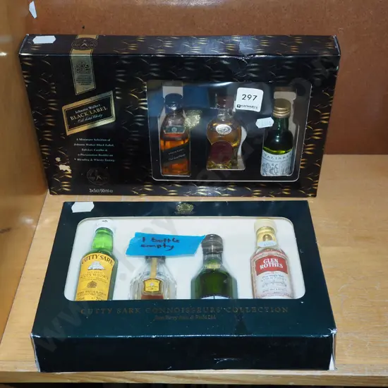 Johnnie Walker black label whisky miniature set, one other set - 1 empty