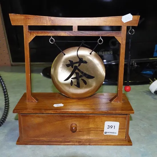 gong with drawer and polished stones