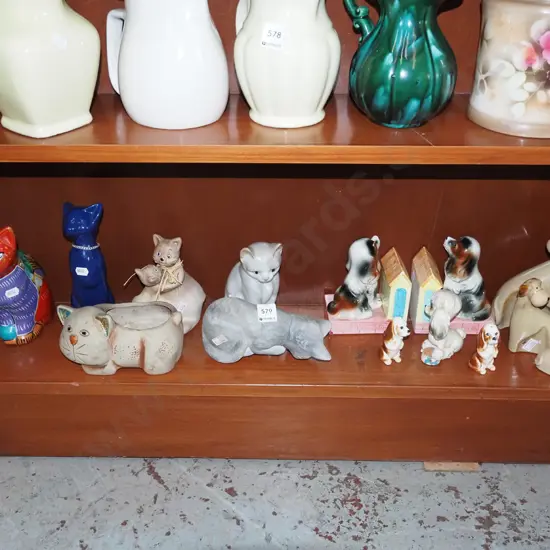 shelf of cat and dog figurines
