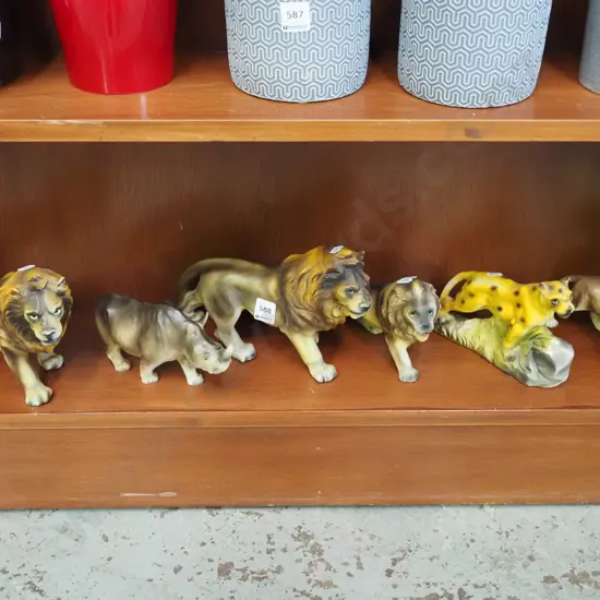 shelf of big cat figurines etc